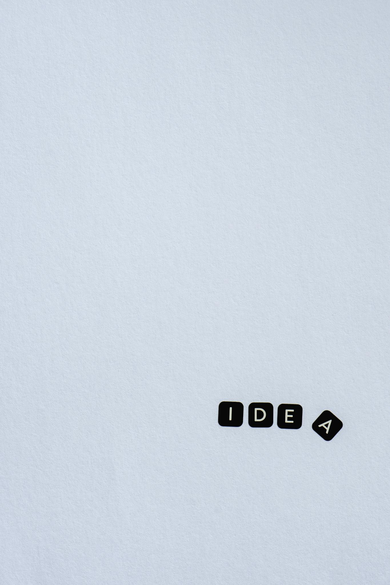 Minimalist design with the word 'Idea' on a light background, perfect for creative and design concepts.