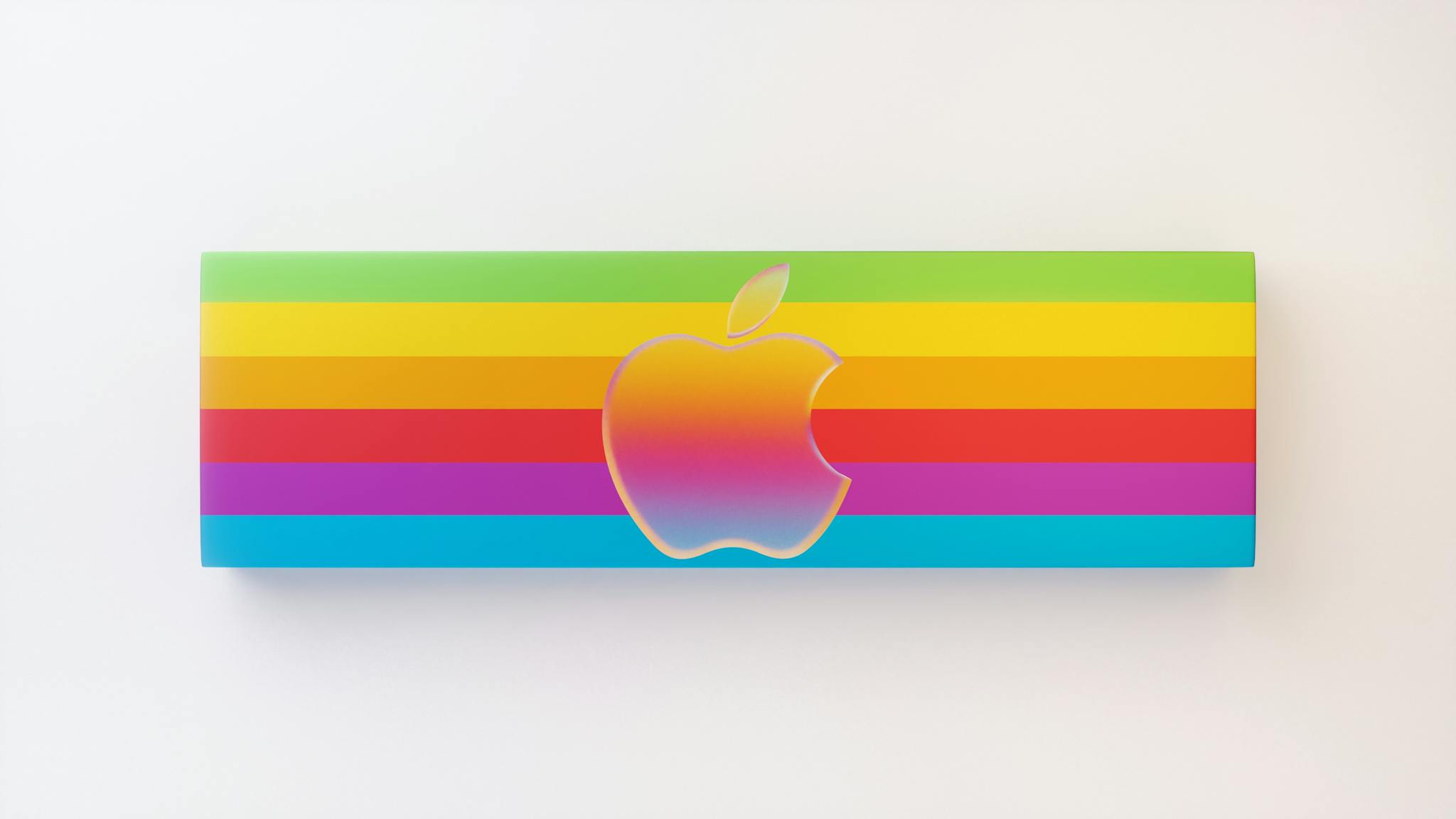 Vibrant rainbow design featuring iconic apple logo against a white backdrop, ideal for brand displays.